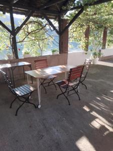 a table and chairs sitting under a pavilion at Jezero 
