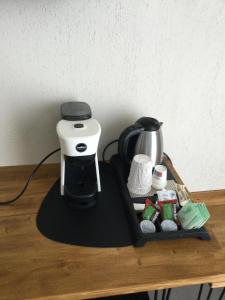a coffee maker sitting on top of a table at B&B SMARTFIT HOUSE - Room & Relax in Pescara in Pescara