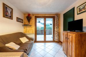 Μια τηλεόραση ή/και κέντρο ψυχαγωγίας στο Appartement Résidence Ours Blanc