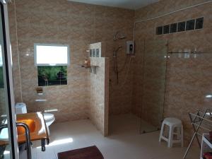 a bathroom with a shower and a toilet at Suites & Gym by Karon Homes in Karon Beach +22 photos