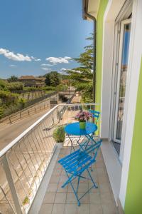 a blue table on a balcony with a view at B&B SMARTFIT HOUSE - Room & Relax in Pescara in Pescara