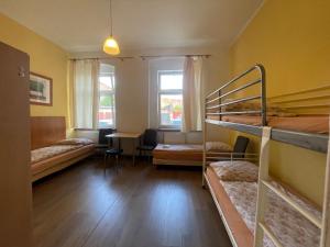 Ένα ή περισσότερα κρεβάτια σε δωμάτιο στο Gościniec Zaborze w sercu Górnego Śląska - Zabrze