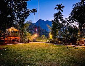 a park at night with a view of a mountain at Hill View Heights Wayanad in Meppādi