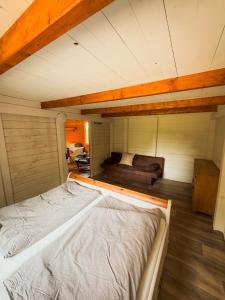 a large bed in the middle of a room at Ferienwohnung Burgkemnitzer Weg in Gröbern
