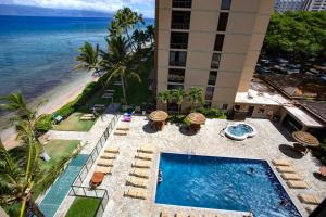 an aerial view of a hotel with a swimming pool and the beach at Mahana by KBM Resorts in Kaanapali