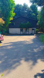 a building with a driveway in front of it at 4-plex Apartment in Burien - Unit 1 - 7 min from Sea Tac Airport - 15 min from Downtown Seattle in Burien