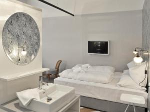 Postel nebo postele na pokoji v ubytování grätzlhotel Karmelitermarkt