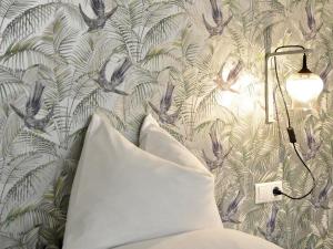 Postel nebo postele na pokoji v ubytování grätzlhotel Karmelitermarkt