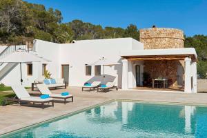 a villa with a swimming pool and a house at Exclusive 4 Bedroom Villa in Mahon 1281 in Sant Carles de Peralta