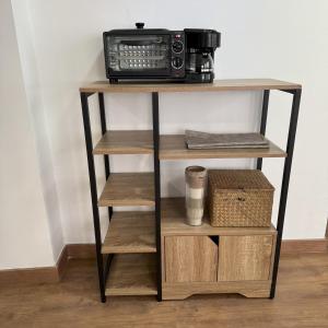 a shelf with a radio on top of it at Med Time Hotel Boutique in Calpe