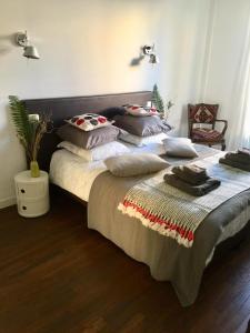 a bedroom with a large bed with pillows on it at Appartement moderne 4p hypercentre de nice in Nice