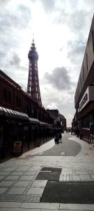 a street with the eiffel tower in the background at Cardoh Lodge in Blackpool
