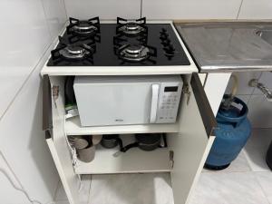 Η κουζίνα ή μικρή κουζίνα στο Studio completo, perto da praia! +5 φωτογραφίες