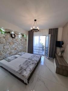 Ένα ή περισσότερα κρεβάτια σε δωμάτιο στο Апартаменты