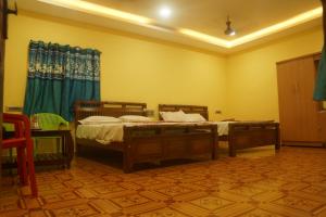 Voodi või voodid majutusasutuse DKS Illam toas +2 fotot