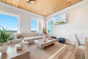 a living room with a couch and a table at Sundune in Gulf Shores