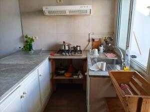 a kitchen with a sink and a counter top at Dari in Sousse