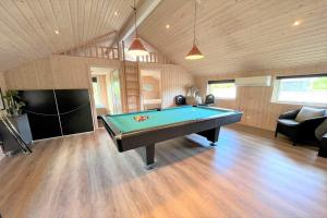 a large room with a pool table in it at M184-Vaeggerlose-Kaninstien-41 in Bøtø By