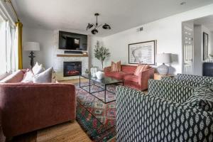 a living room with two couches and a fireplace at Backyard Oasis w/Pool, Hot-Tub, Grill & Fire Pit! in Fredericksburg