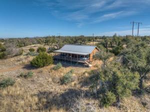 an overhead view of a house in the middle of a field at Rocky Ridge Cedar Cabin with Hot Tub & Amazing Views in Crabapple
