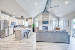 a kitchen and living room with a couch and a table at The Ricardo in Fredericksburg +17 photos