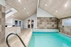 a bathroom with a swimming pool in a house at M235-Vaeggerlose-Kaninstien-33 in Marielyst