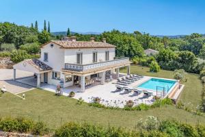 an aerial view of a villa with a swimming pool at Villa Diamant by Villa Plus in Saint-Cézaire-sur-Siagne