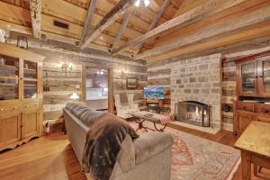 a living room with a couch and a fireplace at Sunset Valley Ranch in Fredericksburg