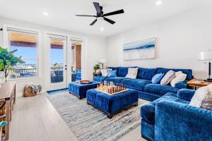a living room with a blue couch and a table at Lakefront Horseshoe Bay Resort Shared Pool Dock in Horseshoe Bay +31 photos