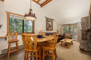 a dining room and living room with a table and chairs at Beaver Village Unit #0131 in Winter Park