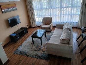 TV a/nebo společenská místnost v ubytování Murei Luxury Comfort