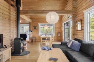 a living room with a couch and a table at M212-Vaeggerlose-Marielyst-Strandpark-127 in Marielyst