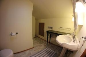 a bathroom with a sink and a toilet at DOWN TOWN BUNGALOW Entire home available in Farmington +12 photos