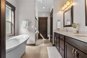 a bathroom with a tub and a sink and a toilet at Blanchard Bliss in Blanchard +42 photos