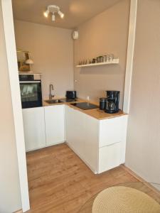 Kuchyň nebo kuchyňský kout v ubytování Apartement Strandhafer sea view + 6 fotografií