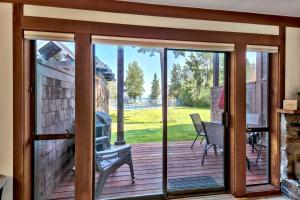 a sliding glass door with a view of a deck at TML 04 - Beautiful 1 BR Condo in Tahoe City in Tahoe City