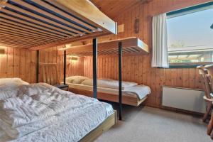 a bedroom with two bunk beds and a window at M21012-Gedser-Allingsgavevej-2 in Gedser