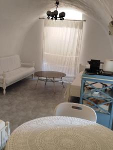 a living room with a couch and a table at Flame Yard in Areopoli +11 photos
