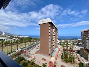 a view of a building with the ocean in the background at LOFT vistas playa jardin in Puerto de la Cruz