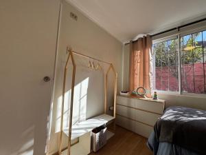 a bedroom with a bed and a window at Spacious and beautiful house in Las Condes in Santiago