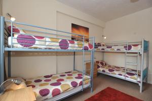 two bunk beds in a small room with at The Bunkroom in Chester