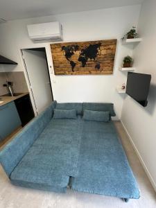 TV a/nebo společenská místnost v ubytování Béligneux Horizons - 4 Personnes