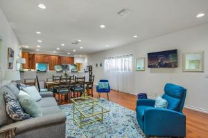 a living room with a couch and a dining room at Relax Explore from Mission Viejo Pool Spa in Mission Viejo