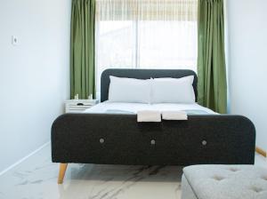 a bed with two towels on it in a bedroom at Villa Stemara in Razlog +26 photos