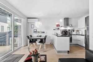 a kitchen with a table and a dining room at M318-Vaeggerlose-Marielyst-Strandvej-63-S in Marielyst