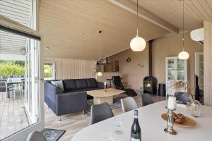a living room with a couch and a table at M197-Vaeggerlose-Musestien-6 in Marielyst