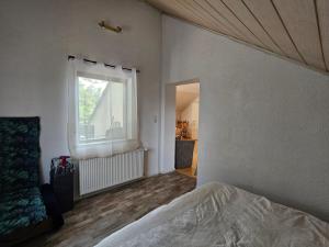 Postel nebo postele na pokoji v ubytování Ela's Kleine Auszeit - im Herzen der Wetterau