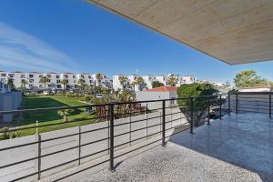 an outdoor balcony with a view of a park at Lira On White Soil in Cape Town