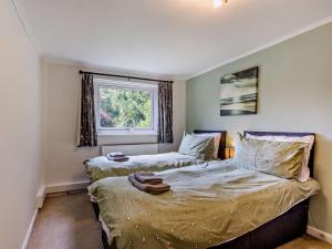 En eller flere senge i et værelse på 2 Bed in Clovelly FORDM