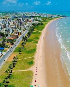 an aerial view of a beach and the ocean at Brazilian Caribbean in Paraíba Wind Palace Flats in Cabedelo